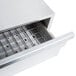 A stainless steel drawer with a grate on top for APW Wyott HR-31 Series Hot Dog Roller Grills.