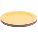 A stack of colorful oval melamine platters in assorted colors.