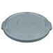 A Rubbermaid grey plastic lid with a circle and a handle.