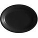 A black oval Tuxton china platter with a rim.