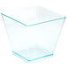 A clear plastic square container with green edges.