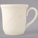 A Homer Laughlin ivory china cup with a handle on a white surface.