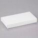 A white rectangular 1/2 lb. candy box with a white lid.