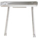 A silver metal rectangular detachable drainboard with two legs.