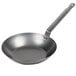 A Vollrath carbon steel frying pan with a handle.