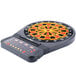 An Arachnid CricketPro Talking electronic dart board with a red and yellow center.