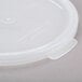 A white plastic lid for a Cambro clear crock.