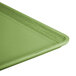 A close up of a rectangular lime green Cambro dietary tray.
