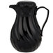 A black Vollrath SwirlServe hot and cold beverage server with a handle.