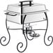 A stainless steel Choice half size chafer with black wrought iron stand on a counter.