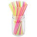 A jar full of Choice neon beverage stirrers with sip straws in multiple colors.