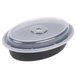 A black Pactiv plastic oval container with a clear lid.