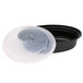 A black plastic Newspring oval microwavable container with a plastic lid containing a disc.