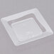 A clear square plastic container with small square trays inside.