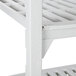 A white Cambro Camshelving unit with four vented shelves.