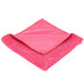 A red Unger SmartColor Microfiber cloth with a folded edge.