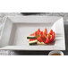 A Princesquare bright white porcelain pasta bowl filled with sliced watermelon and tomatoes.