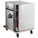A large stainless steel Metro heated holding cabinet on wheels.