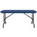 A blue rectangular Correll folding table with black pedestal legs.