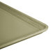 A close-up of a Cambro olive green dietary tray on a counter.