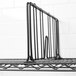 A Metro black wire shelf divider on a black wire shelf.