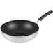 A close-up of a black Vollrath SteelCoat x3 Non-Stick Stir Fry Pan.