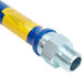 A blue and yellow Dormont stainless steel gas connector hose with metal ends.
