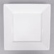 An Arcoroc white porcelain square plate with a white rim.