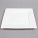 A white square Arcoroc porcelain plate with a square edge.