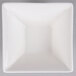 An Arcoroc white square bowl on a gray background.