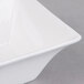 A close-up of a white Arcoroc Square Up bowl.