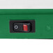 A close up of a green and red switch on a white background.