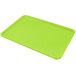 A lime green Carlisle Glasteel bakery tray with a small hole in the middle.