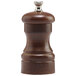 A Chef Specialties walnut pepper mill with a silver top.