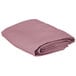 A folded pink Intedge 100% polyester table cover.