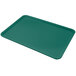 A Carlisle forest green Glasteel bakery tray on a white background.