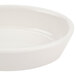 An ivory oval baker dish with a small rim.
