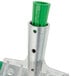 A metal pole with a green Unger AquaDozer insert.