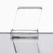A clear glass square on a table.