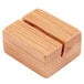 An American Metalcraft natural bamboo table card holder with two holes in it.