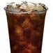 A plastic cup of brown liquid with small cube ice from a Scotsman undercounter ice machine.