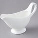 An American Metalcraft white porcelain gravy boat on a gray background.