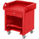 A red plastic cart with heavy duty casters and a shelf.