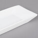 A white rectangular porcelain platter with a small square edge.