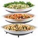A black Cal-Mil three tier display stand with bowls of salad, pasta, and olives.