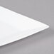 A white Cal-Mil square porcelain platter.