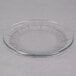A Libbey Gibraltar clear glass salad/dessert plate on a white surface.