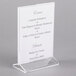 A Cal-Mil acrylic displayette stand with a menu card.