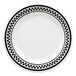 A white wide rim plate with black and white checkered trim.