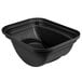 A black Rubbermaid rectangular soft wastebasket with a swing lid.